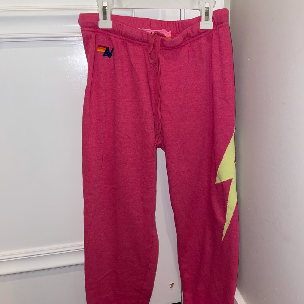 Aviator Nation pink sweatpants with lightning bolt